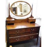 An Edwardian mahogany dressing table, oval mirror and two short drawers to the superstructure, two