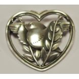 A Georg Jensen silver brooch designed by Arno Malinowski, model no,239, in heart-shaped rim, with