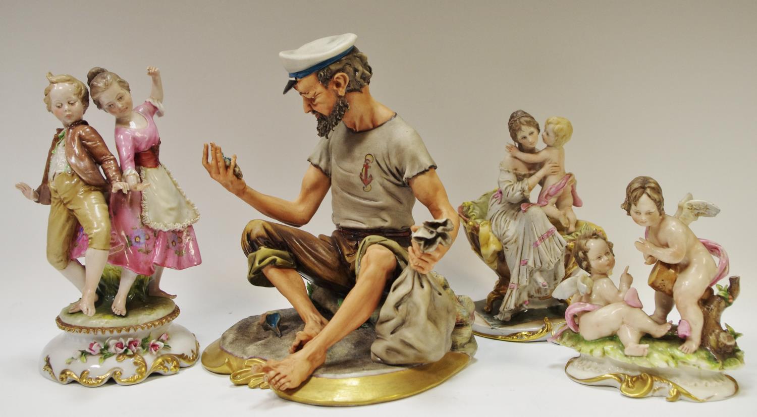 A Capodimonte figure 'Fisherman and Pearl', signed Volta; others unsigned including 'Bath Time', '