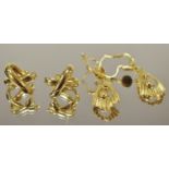 A pair of 18ct gold earrings, two hoops forming an X; an other pair of 18ct gold drop earrings metal