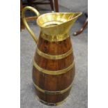 A 19th century coopered barrel jug, 63cm high