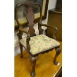 A child's carver chair, shaped top rail, vasular splat, stuffed overseat, cabriole forelegs, club