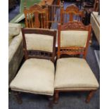 A Victorian mahogany dining chair with padded back and seat; another; an oak side chair; two stained