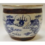 A 19th century Chinese crackle glazed jardinere decorated with fercious dragon chasing the pearl
