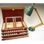 An artists easel paint box, hinged lid revealing easel, three drawers coating oil paints and