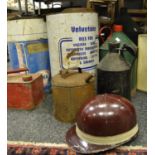 An Everoak racing helmet; vintage petroleum spirit cans; Esso tractor lube drum; Fina, Castrol,