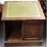 A reproduction oak free standing book case, leather inlaid top