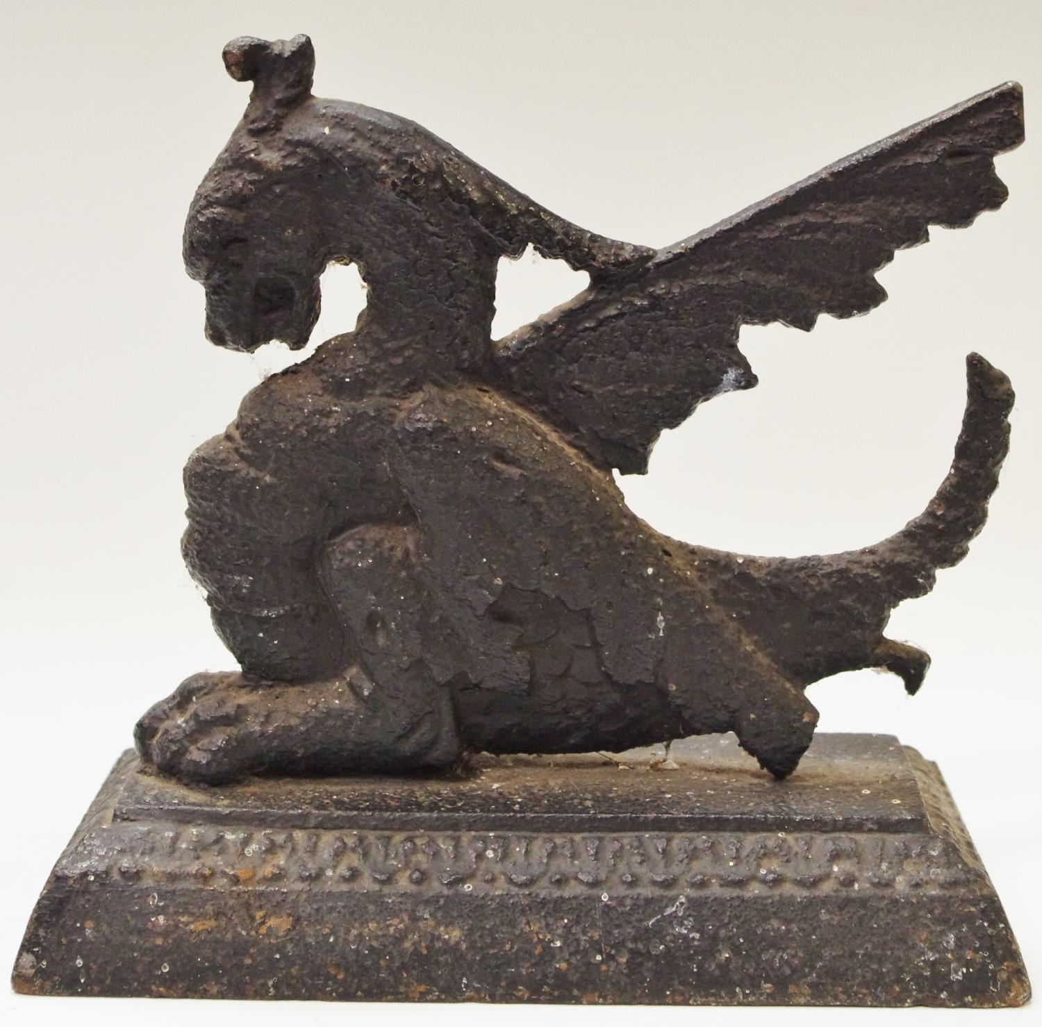 A 19th century cast iron griffin doorstop