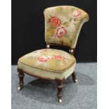 A Victorian oak side chair, stuffed over tapestry upholstery, fluted legs.