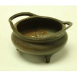 A 19th century Chinese bronze open censer, three styled feet 8cm over handles