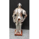 A model of a medieval knight in shining armour, wooden plinth. 72cm