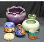 A Lovatts Langley Ware jardiniere in a purple glaze, cm high; a Langley Art Nouveau tobacco jar