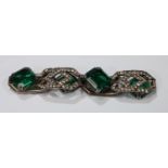 An Art Deco silver bracelet of geometric form, set with green and clear glass stones, marked 935,