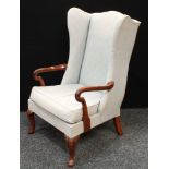 A George II style wing back armchair.
