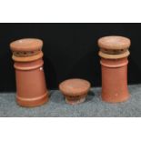Stoneware - A near pair of clay chimney breasts. Another chimney cowl. 59cm high (3).