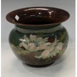 A Langley Ware jardiniere, painted with flowers in tones of pink on a green and brown glazed ground,