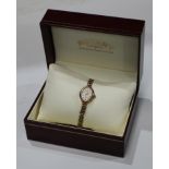 A lady's 9ct gold Rotary wristwatch with integral 9ct bracelet strap, two small spare links, 12.1g
