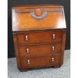 A 20th century oak bureau, fall front enclosing pigeonholes above three long drawers.105cm high,