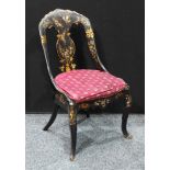 A Victorian papier maché chair in the manner of Jennens and Bettridge, inlaid with mother-of-pearl