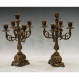 A pair of cast brass four branch candelabra, quatrefoil bases, 36cm