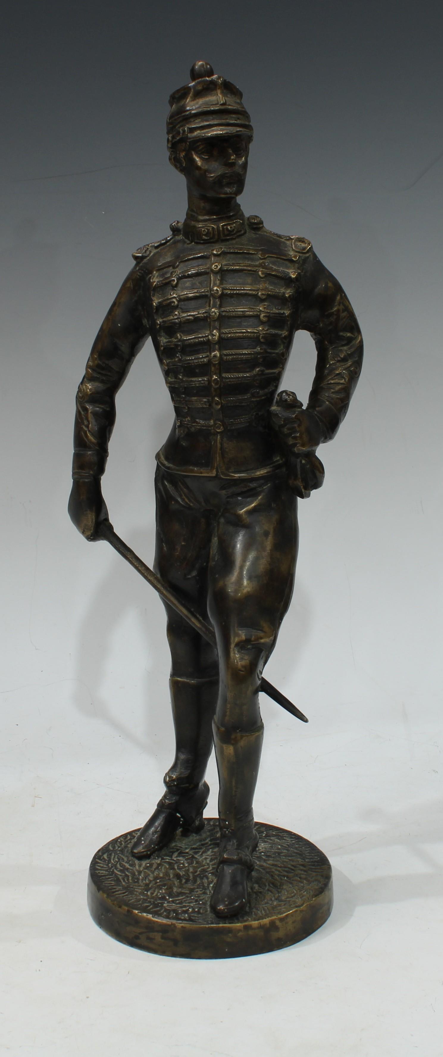 A dark patinated bronze, of an infantry solider in uniform, circular base, 39cm high