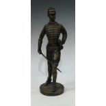 A dark patinated bronze, of an infantry solider in uniform, circular base, 39cm high