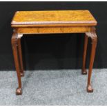 A contemporary Queen Anne design card table, hinged top enclosing a baize lined playing surface,