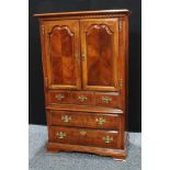 A mid 20th century mahogany tall boy, rectangular top above a pair of cupboard doors inclosing a