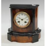 A Victorian walnut and ebonised mantel clock