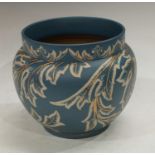 A late 19th century Langley Ware jardiniere, incised decoration on a blue ground, impressed marks to