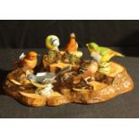 A set of six Beswick bird models, Robin, Chaffinch, Blue Tit, Grey Wagtail, Greenfinch and Wren; a