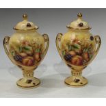A pair of Aynsley Orchard Gold pedestal urns and covers, 22.5cm high (2)