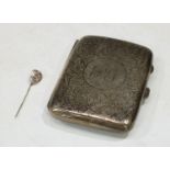 A silver rounded rectangular cigarette case, gilt interior, Birmingham 1909, 79.6g; a silver pin,