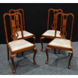 A set of four early 20th century walnut dining chairs