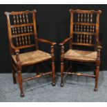 A pair of country house elm dining/side chairs, the back with rows of turning spindles, rush