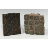 A 19th century carved treen printing block, with love heart motif, 15cm wide; another similar (2)