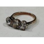 A 9ct gold three stone diamond effect dress ring, S & CO, Birmingham 1978, size O, 3.6g gross