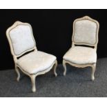 A pair of early 20th century bedroom side chairs, cabriole legs, stuffed over upholstery (2).