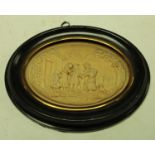A 19th century wax picture, in relief with a genre scene, oval, 7cm x 9.5cm