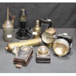 Aladdinette black tin paraffin chamberstick type lamp; a British Miller lamp; a Daimon Telko trio