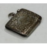 A Victorian silver rounded rectangular vesta case, Birmingham 1898