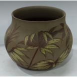 A late 19th century Langley Ware jardiniere, incised decoration in tones of brown and yellow on a