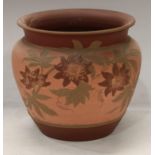 A late 19th century Langley Ware jardiniere, incised decoration of flowers in tones of red on a pink
