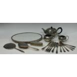 A silver three piece Art Deco hand mirror and hairbrush set, Birmingham 1941; a pewter three piece