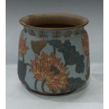 A late 19th century Langley Ware jardiniere, incised decoration of tropical lotus lilies in tones of