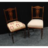 A pair of Edwardian rosewood and marquetry side chairs, turned front legs, stuffed over upholstery(