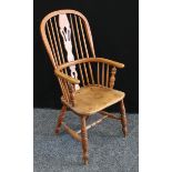 A Windsor armchair, pierced slat, h-stretcher