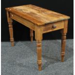 A 19th century pine farmhouse table, 75cm high.