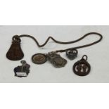 A silver medal fob, Mildenhall & District League 1922; another, gold coloured metal mounted