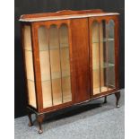 An early 20th century oak display cabinet, cabriole legs.121cm high.